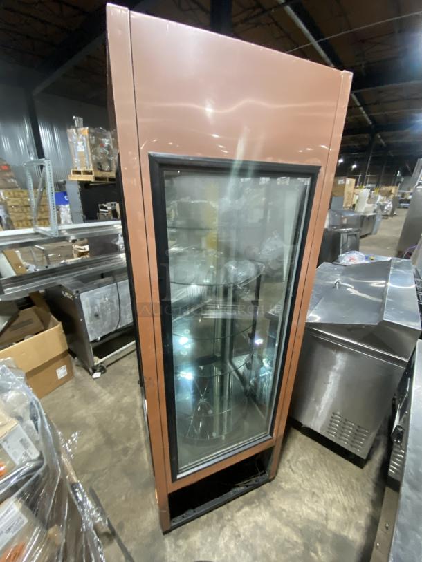 True Commercial Glass Door Bakery Display Merchandiser, model G4SM23RGS, with rotating shelves. One shelf broken. 115V, 1 Phase.