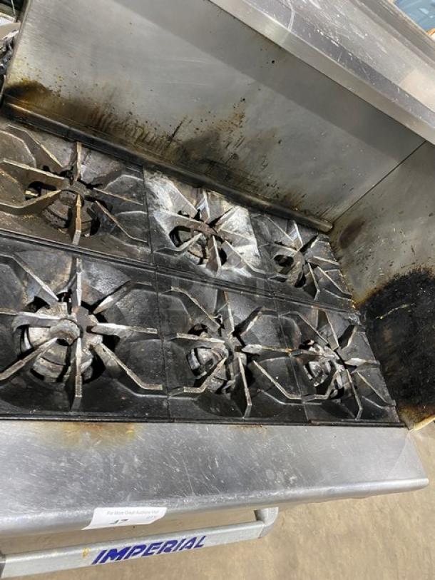 Imperial commercial 6-burner natural gas stove with overhead salamander shelf and full-size oven, stainless steel, used condition.