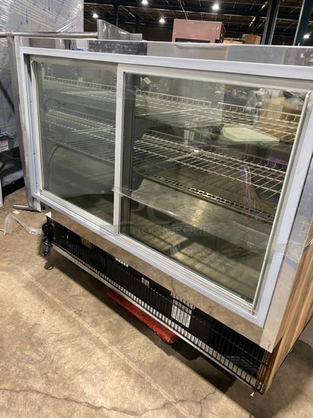 Marc SQBR59 refrigerated bakery/deli display case, 115V, with two sliding glass doors and poly coated racks.