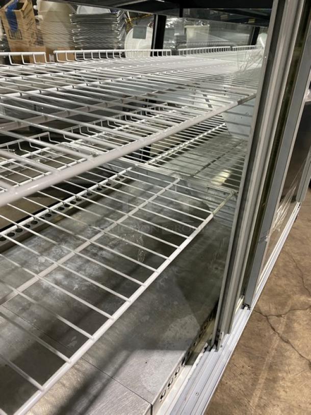 Marc SQBR59 refrigerated display case with poly-coated racks, 2 glass sliding rear doors, 115V 1Phase, for bakery/deli use.