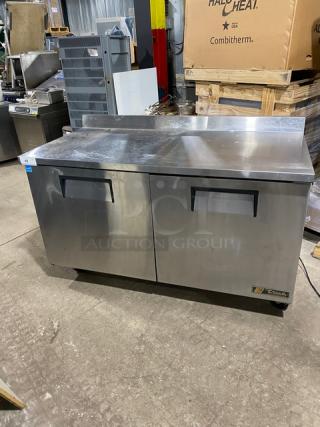 True TWT60 commercial refrigerated prep table with backsplash, stainless steel, 2-door storage, poly-coated racks, on casters.
