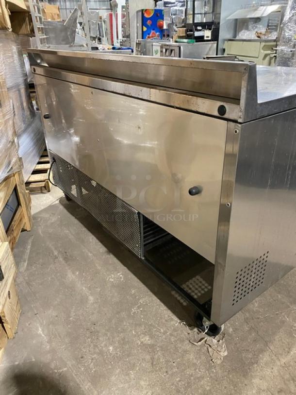 True commercial refrigerated work/prep table, stainless steel, model TWT60, 2-door storage, poly-coated racks, on casters.