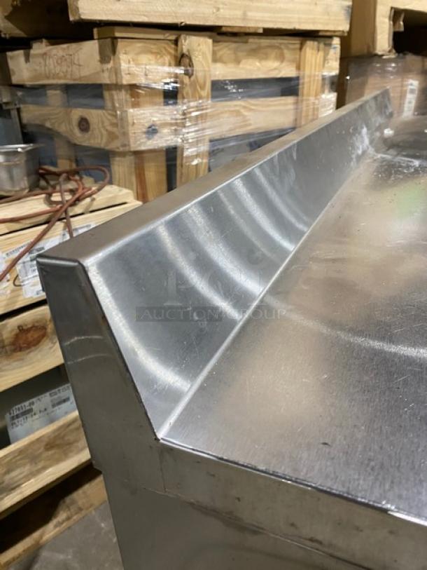 True Commercial Refrigerated Work/Prep Table with backsplash, 2-door storage, poly-coated racks, stainless steel, Model TWT60.