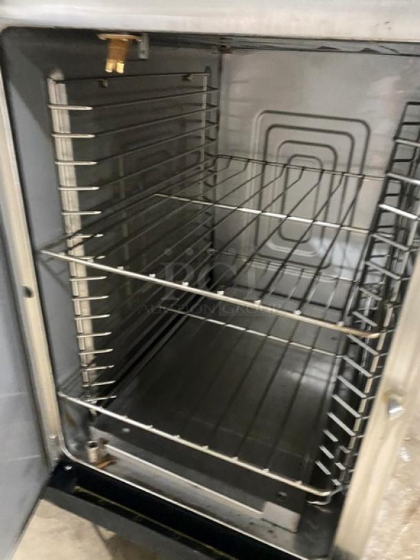 Alto Shaam 1200TH Cook-N-Hold Oven, stainless steel, 2 half doors, interior racks, on casters, model 1200TH, serial 32078831.