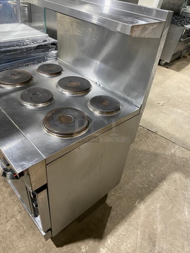 Cookline commercial 6 burner induction range, stainless steel, with raised backsplash, salamander shelf, and oven, 208V.
