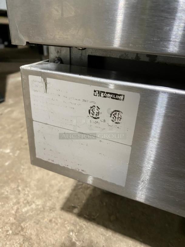 Cookline commercial 6 burner induction range, stainless steel, raised backsplash, salamander shelf, oven, 208V, label shown.