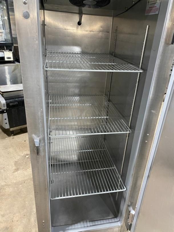 Continental Model 1R single door refrigerator, stainless steel, poly coated racks, 115V, on casters. Serial 15647538.