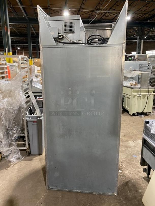 Continental commercial single door food warmer, all stainless steel, used condition, rear view showing power cords.