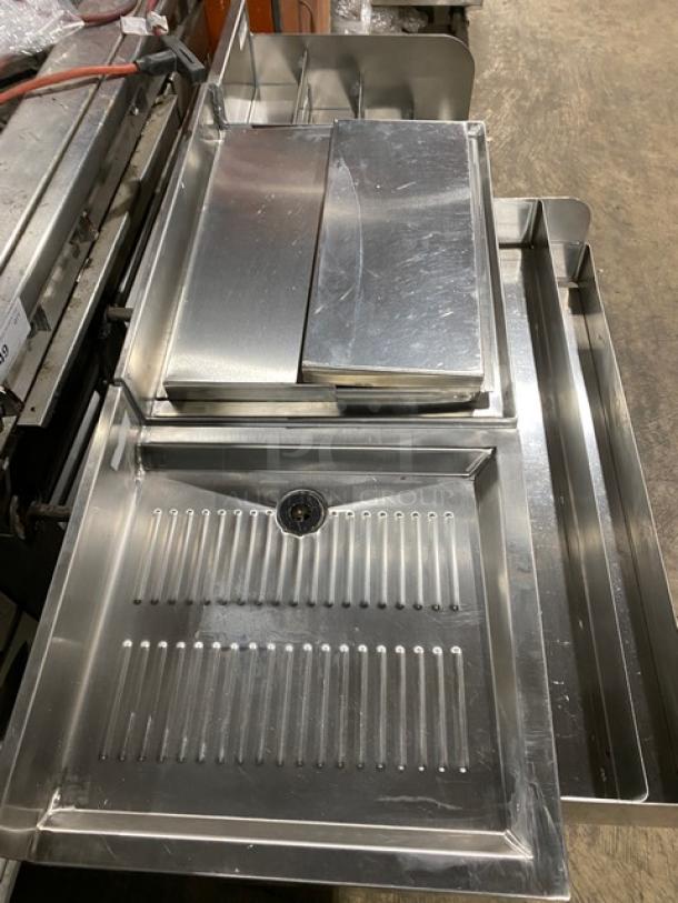 Stainless steel NBR LD1218 underbar sink with left draining table and right bottle display, on legs. Excellent condition.