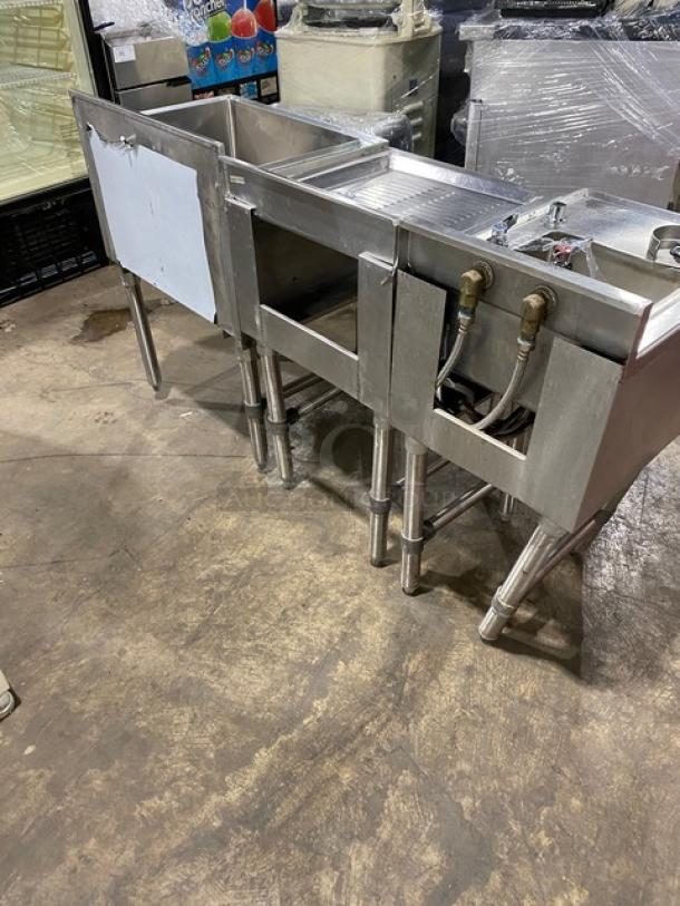 NBR stainless steel commercial sink with drying rack, hand sink, and speed rail, model UW110121521TDV, on legs.