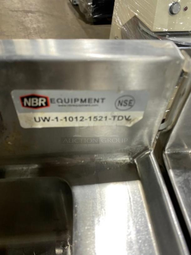 NBR stainless steel under-bar sink with drying rack, hand sink, speed rail; Model UW110121521TDV. In good condition.
