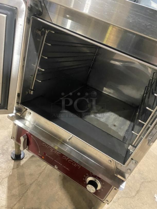 Southbend EZ3 electric countertop steamer, stainless steel, 208V 3-phase, on legs, open door showing interior.