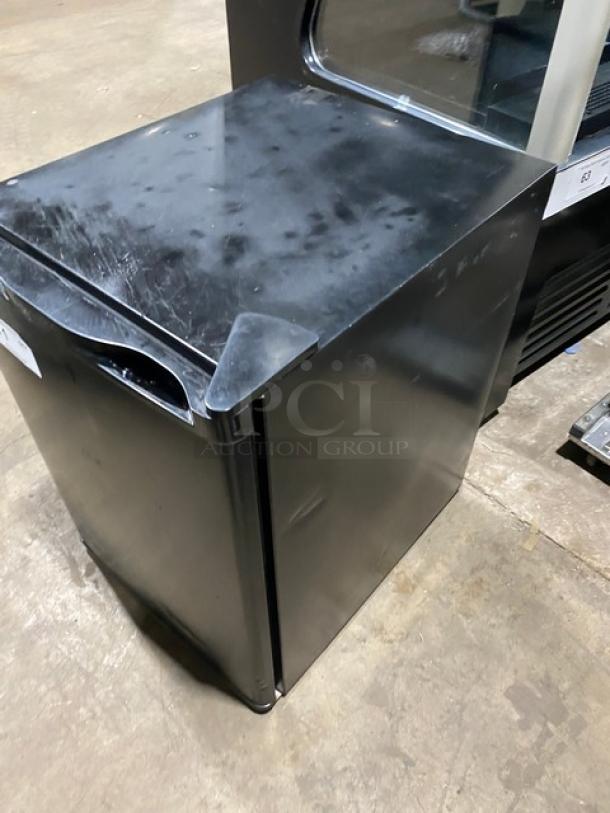 2020 Antarctic Star BD60E countertop reach-in freezer with single door, black finish, and poly coated racks, 115V.