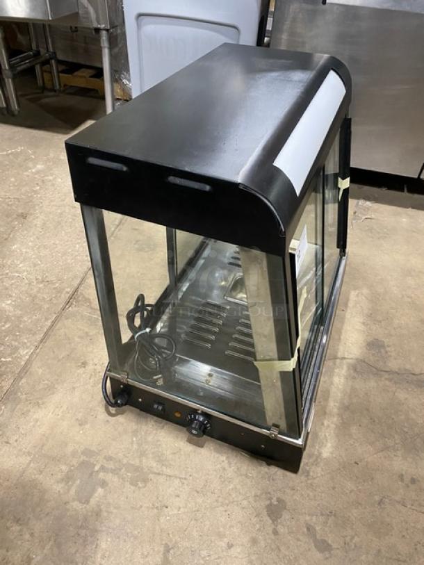Commercial countertop warming food display case, model FW22. Glass showcase, two sliding rear access doors, 110V 1Phase.