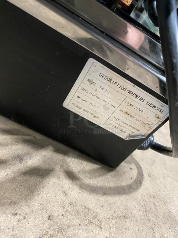 Commercial countertop warming food display case, model FW22, with glass sides and two sliding rear access doors.