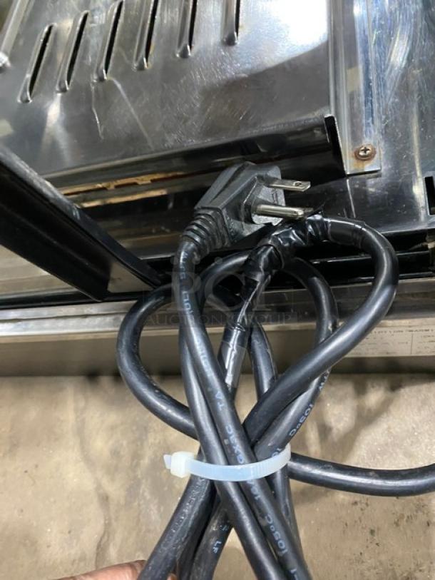 Commercial countertop warming display case model FW22, with glass showcase and 2 sliding doors, 110V, visible power cord.