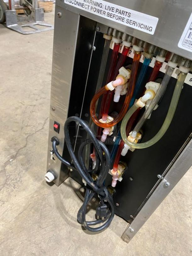 Blendtec commercial countertop blender with ice dispenser, stainless steel, digital controls, and 120V power.