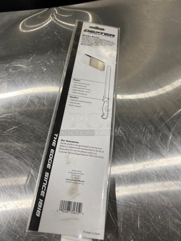 Dexter 12" scalloped slicing knife in original packaging, new condition, labeled with care instructions, guarantee, and contact info.
