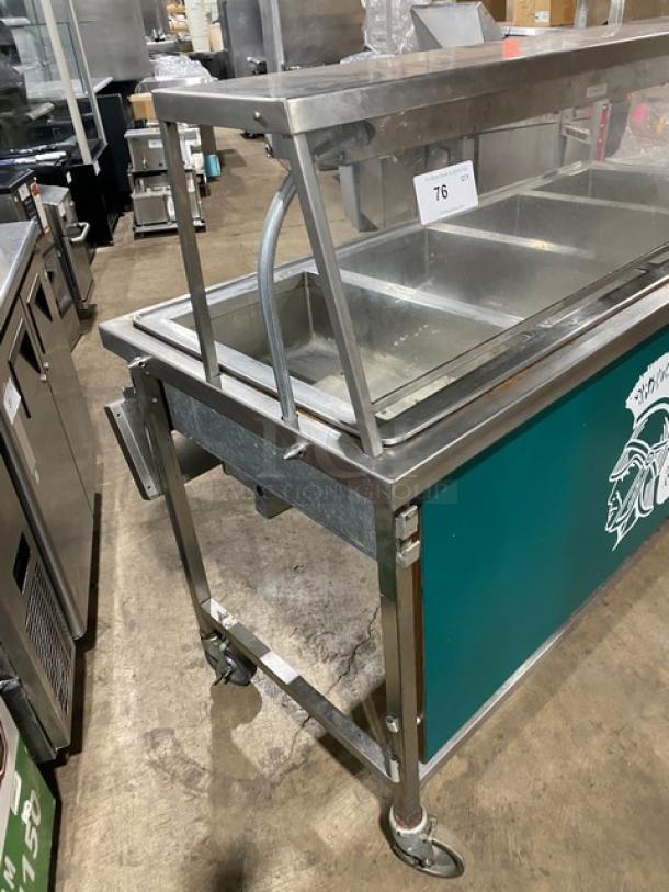 Atlas Metal Model VIH4 4-bay steam table with sneeze guard, lowering prep/serve line, green panel, on casters, 240V.