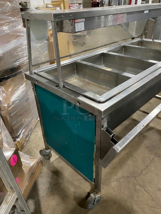 Atlas Metal Model VIH4 4 Bay Steam Table, includes sneeze guard and lowering prep/serve line, on casters, 240V.