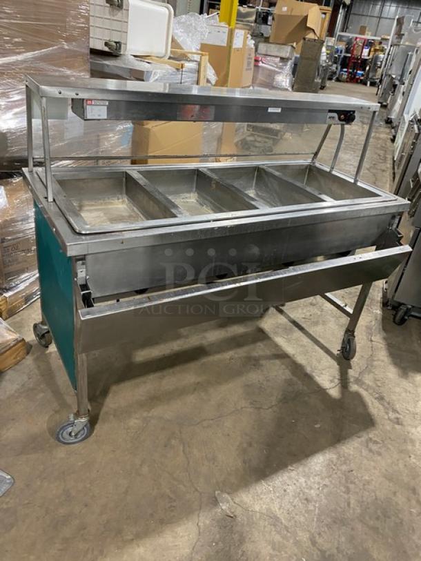 Atlas Metal VIH4 4-Bay Steam Table with sneeze guard and lowering prep line, 240V, on casters, good condition.