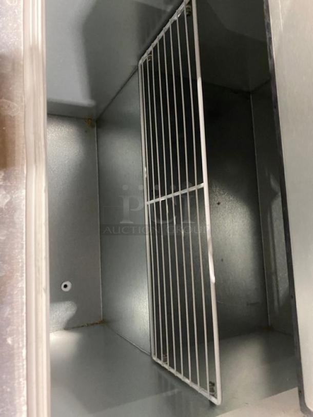 Master Bilt DC4DSE ice cream cabinet interior with stainless steel finish and grid, model DC4DSE, serial 221709LFF01.