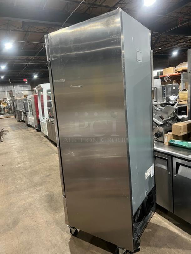 Atosa MBF8501GR commercial single door reach-in freezer, stainless steel, with poly coated racks, on casters.