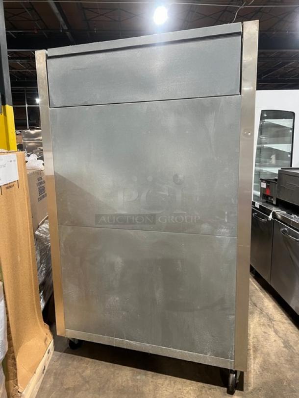 True commercial refrigerator, model STG2R4HS, with four stainless steel half doors, on casters. Serial 7630823.