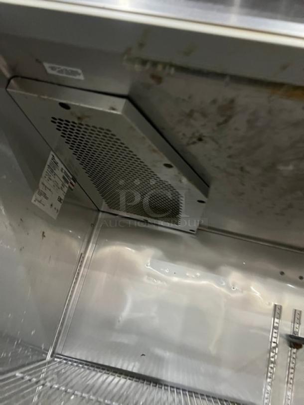 True Commercial Reach In Refrigerator interior, Model STG2R4HS. Features stainless steel, 4 half doors, on casters. Serial 7630823.