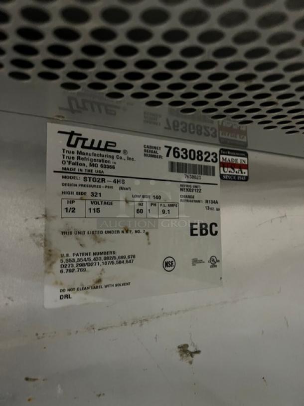 True Commercial Refrigerator, Model STG2R4HS. Stainless steel, 4 half doors, on casters. Serial 7630823, 115V 1Phase.