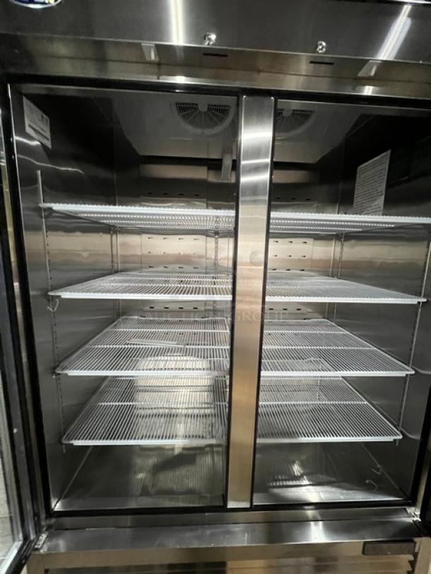 2018 Atosa MCF8703GR 2-door reach-in freezer with poly-coated racks, view-through doors, and casters. Serial: MCF8703GRAUS100318122000C40019.