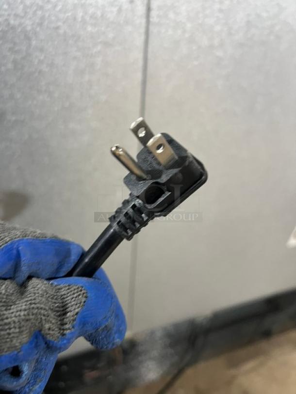 Close-up of a plug showing the 115V connection for an Atosa 2 Door Reach In Freezer, Model MCF8703GR.