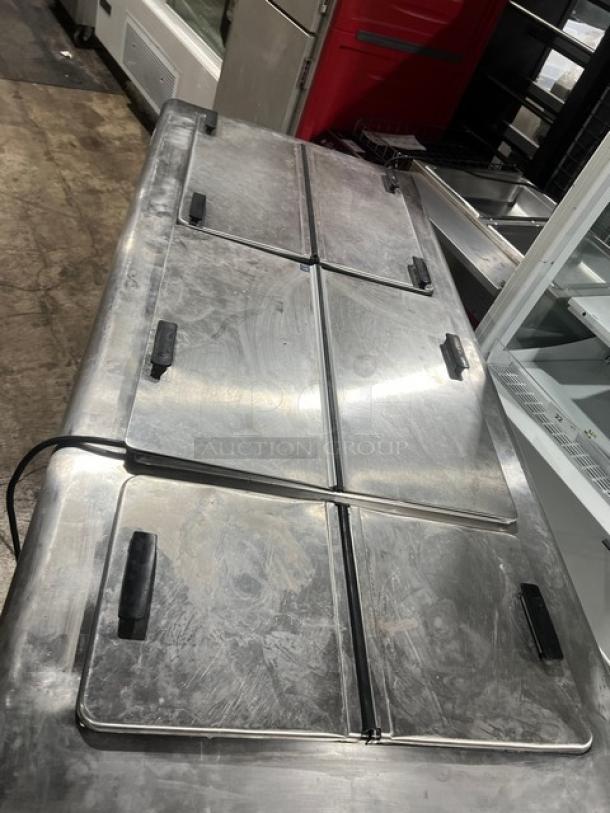 Alto Shaam 1200TH dipping cabinet with 6 flip top lids, on casters. Model 1200TH, serial 32078831, 208/240V, 1Phase.