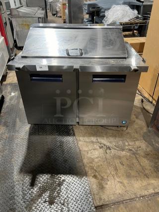 Hoshizaki refrigerated sandwich/salad prep table, model SR48B18M, stainless steel, two-door storage, poly coated racks, on casters.