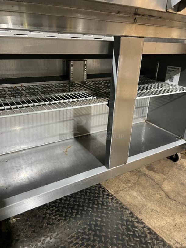 Hoshizaki SR48B18M commercial refrigerated prep table, stainless steel with 2-door storage, poly racks, on casters.