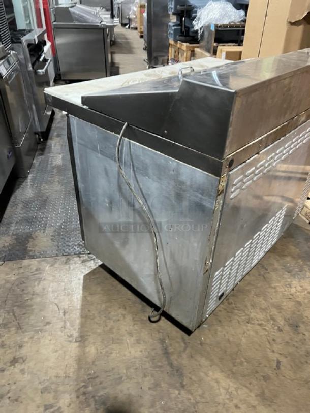 Continental SW4818M stainless steel refrigerated prep table with cutting board, 2-door storage, 115V, commercial use.