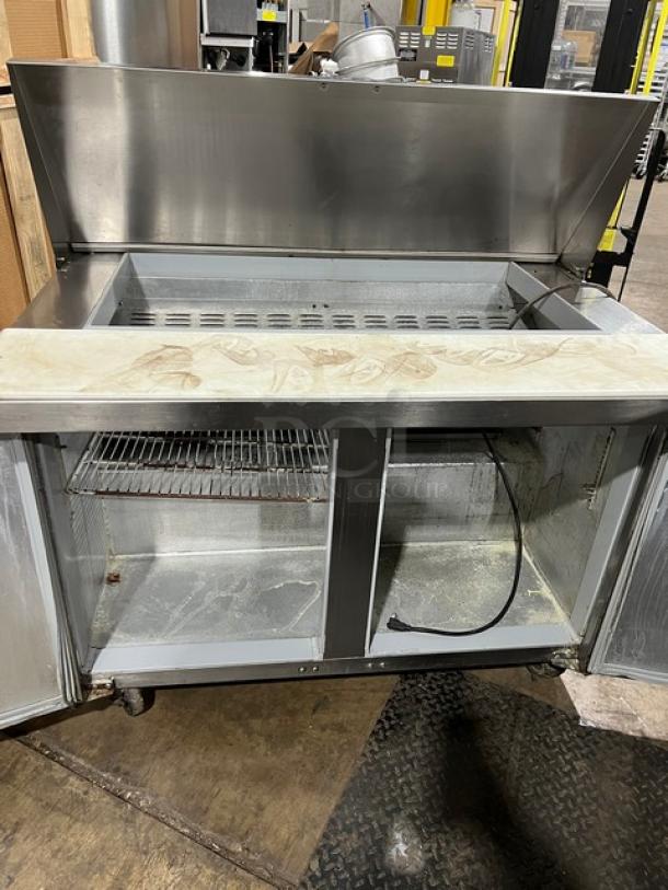 Continental refrigerated prep table, model SW4818M, stainless steel, 2-door storage, commercial cutting board, 115V, used condition.