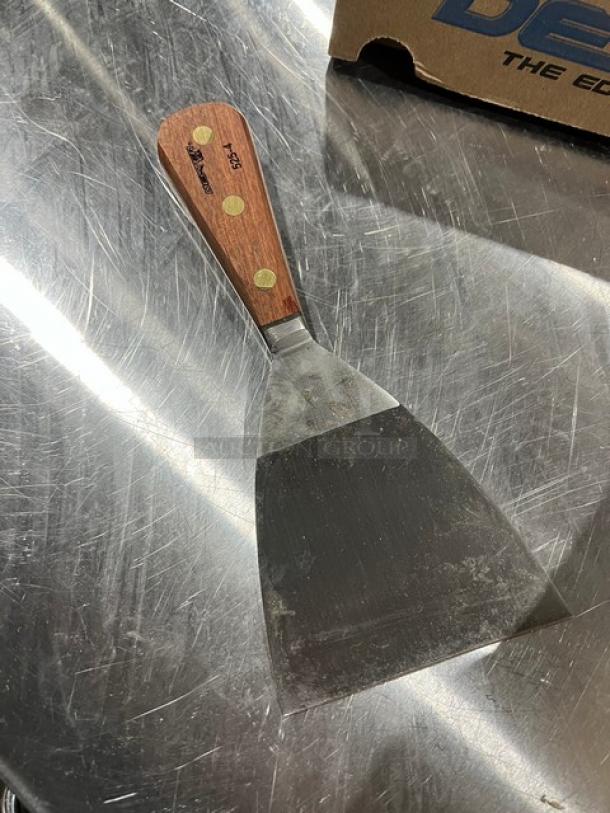 Dexter 4" stiff griddle scraper, Model 5254, wood handle with brass rivets, lightly used condition, ideal for griddles.