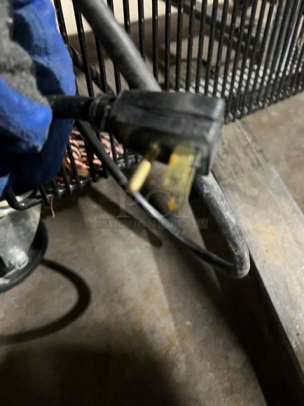 Electrical plug of True T72HC refrigerator, part of the commercial stainless steel unit.