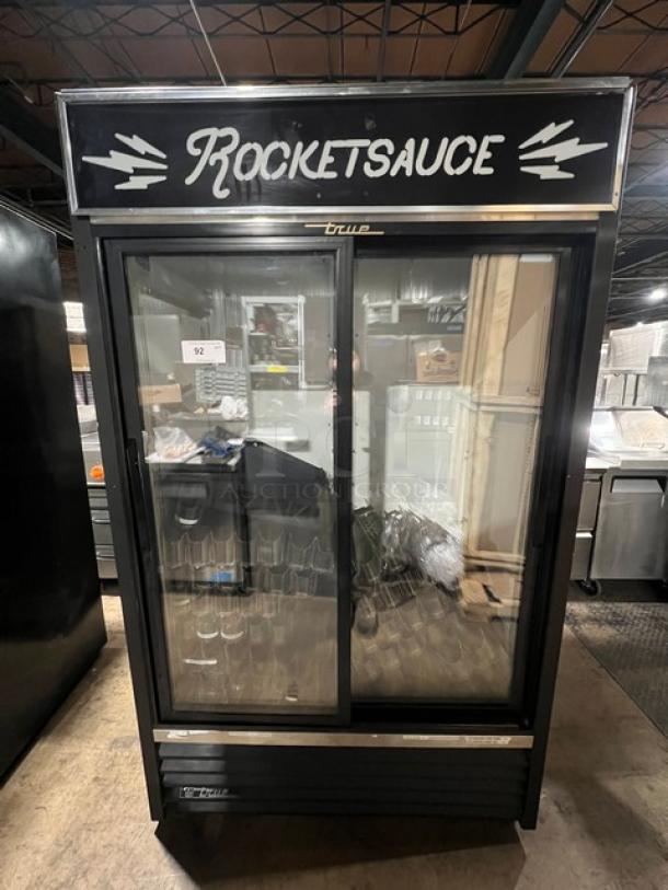 True GDM41 Commercial 2 Door Refrigerator Merchandiser with sliding glass doors, black frame, branded "Rocketsauce," 115V 1Phase.