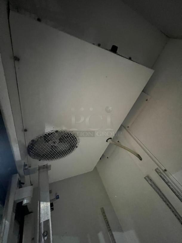 True GDM41 commercial refrigerator interior, showing sliding view-through doors and cooling components. Model: GDM41, Serial: AK9434A.