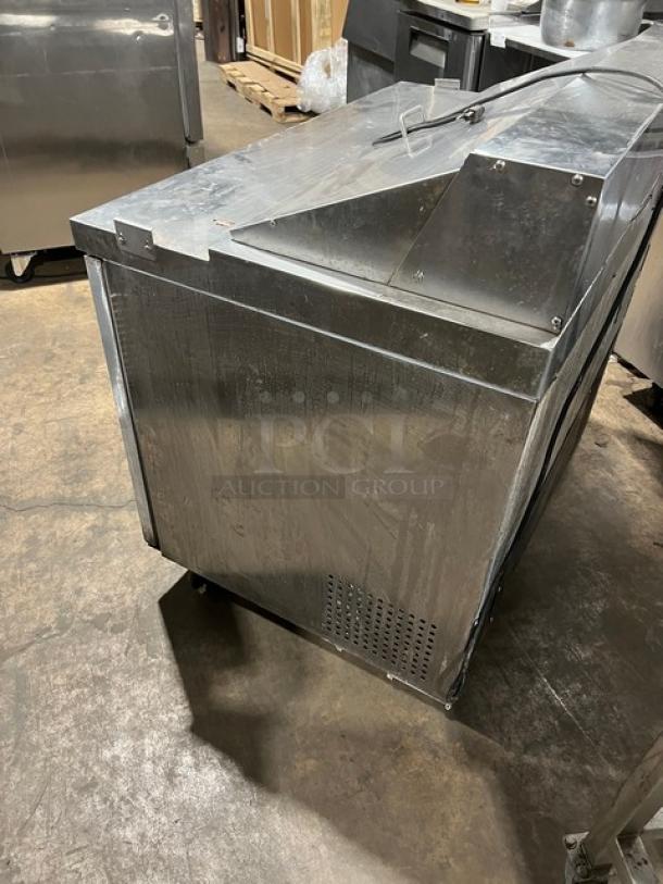 Avantco stainless steel refrigerated sandwich/salad prep table, two-door storage, 115V, commercial use, side view.