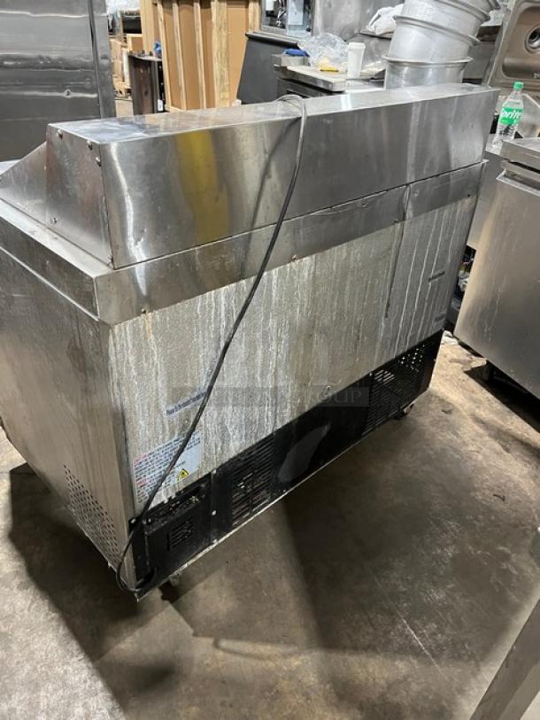 Avantco commercial refrigerated prep table, stainless steel, 2-door storage, 115V, visible wear.