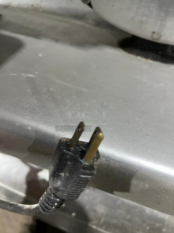 Stainless steel Globe S13 deli meat slicer with 13-inch blade, 110V, 1 phase; commercial countertop model with visible power plug.