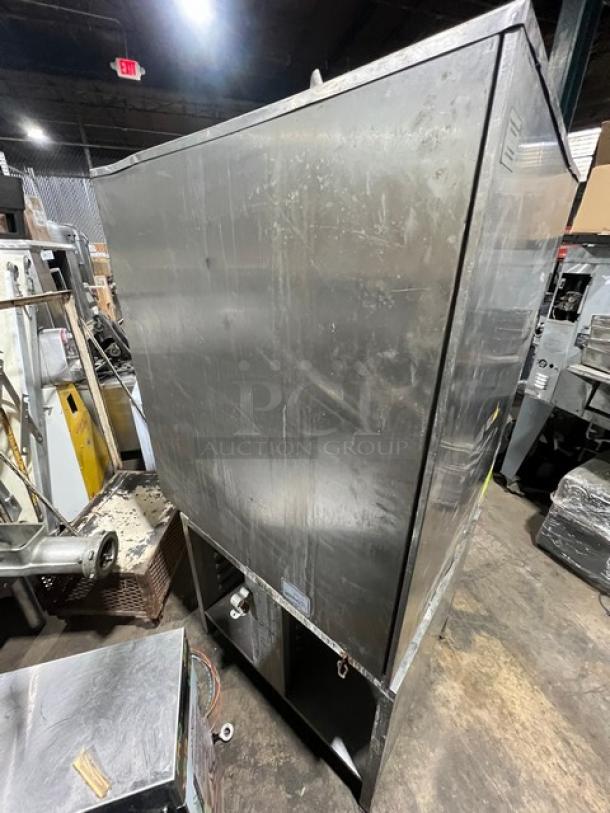 Rational SCC101G natural gas combi oven, stainless steel, on equipment stand, side view, used condition. Serial G11SE070821115.