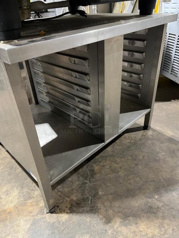 Stainless steel commercial equipment stand for Rational SCC101G combi oven, with durable construction and ventilation slots.
