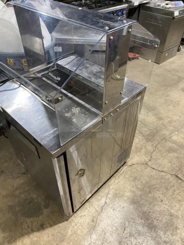 Turbo Air stainless steel single door refrigerated prep table, model MST28N711S, with sneeze guard and poly-coated rack.