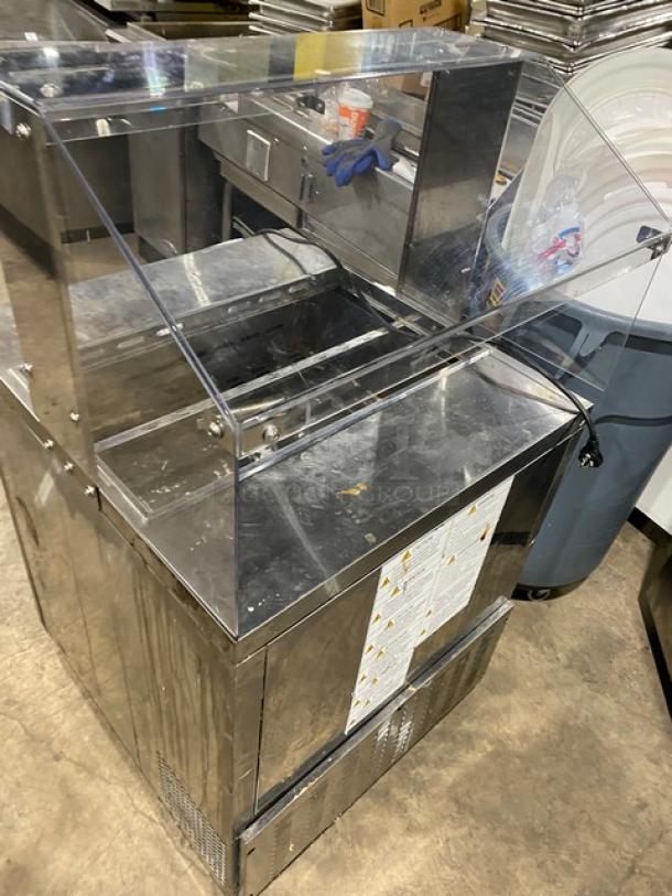 Turbo Air stainless steel refrigerated salad prep table, model MST-28-N-711S, with sneeze guard and poly-coated wired rack.