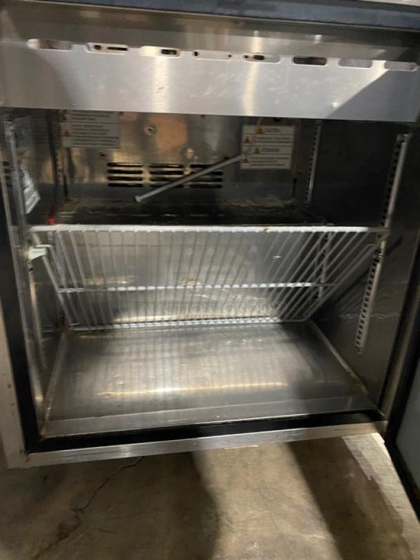 Turbo Air MST-28-N-711S stainless steel refrigerated prep table, includes sneeze guard, poly coated wired rack, 115V, single door.