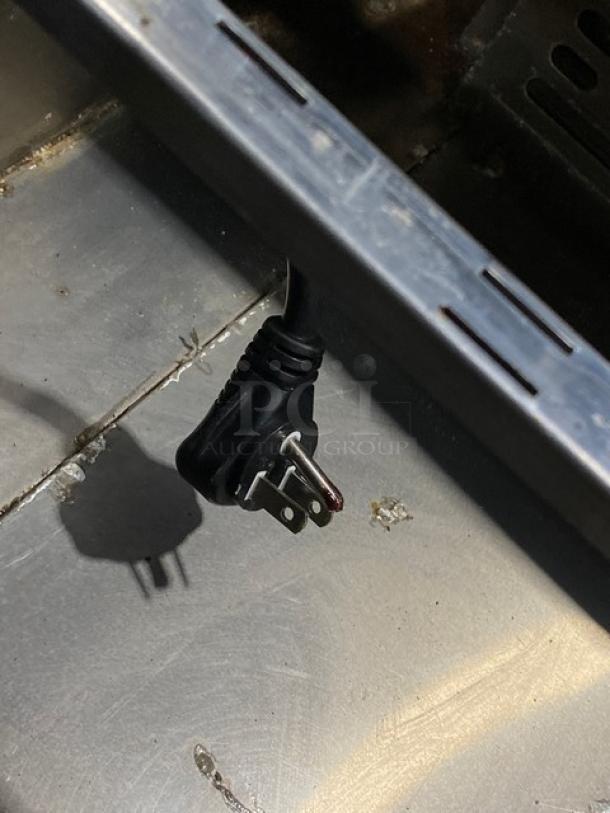 Turbo Air MST28N711S refrigerated prep table power cord and surrounding stainless steel surface, showcasing electrical compatibility.